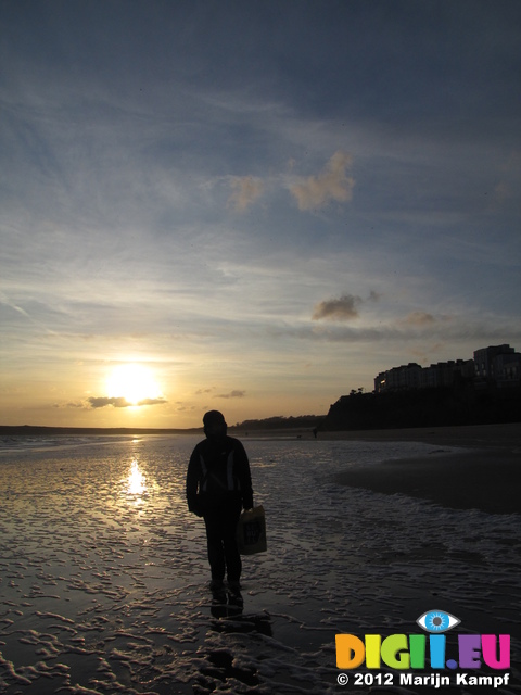 SX21252 Jenni with sunset over Tenby South Beach